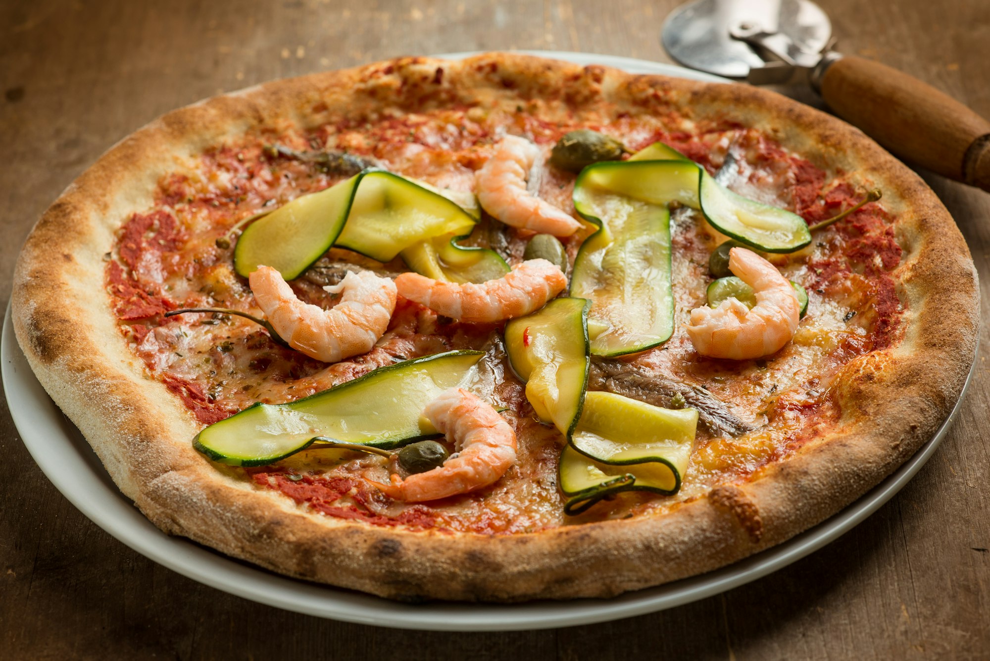 pizza with shrimp and zucchinis